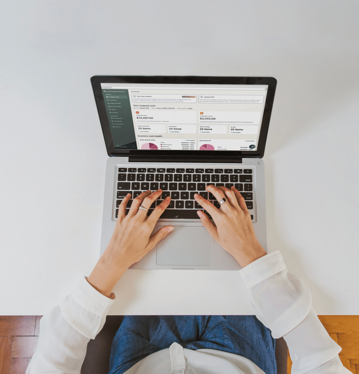 An operator reviewing an inventory dashboard on a laptop